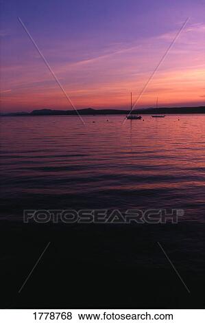 Boats in the distance View Large Photo Image Stock Photo - Boats in the distance. Fotosearch