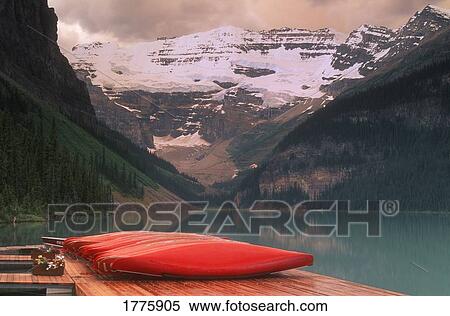 Canoes lined on dock View Large Photo Image Stock Photography - Canoes lined on dock. Fotosearch