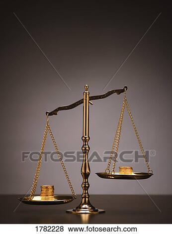 Stock Photo - A scale balancing money. Fotosearch