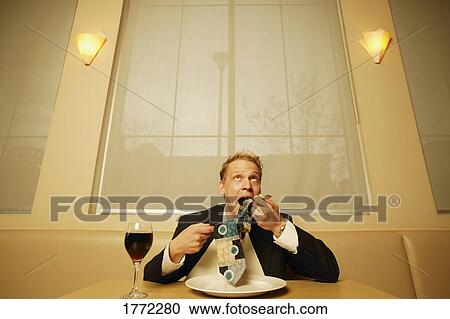 Businessman eating his tie View Large Photo Image Stock Image - Businessman eating his tie. Fotosearch