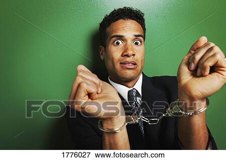 Stock Photo - Businessman in handcuffs. Fotosearch