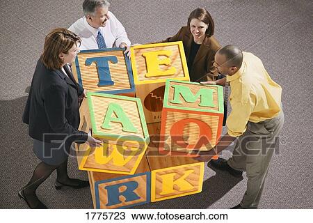 Businesspeople stacking blocks View Large Photo Image Stock Image - Businesspeople stacking blocks. Fotosearch