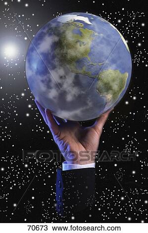 Globe in space held up by hand View Large Photo Image Stock Image - Globe in space held up by hand. Fotosearch