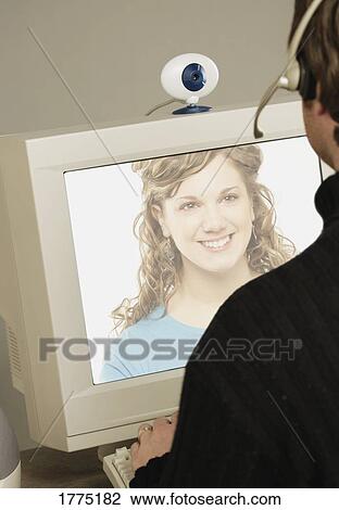 Using a webcam View Large Photo Image Stock Image - Using a webcam. Fotosearch