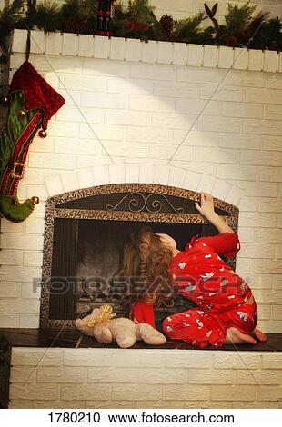 Stock Image - Child checks for Santa. Fotosearch