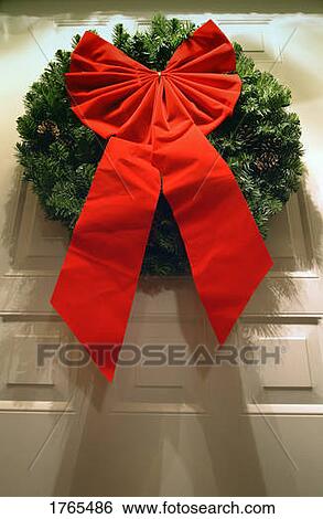 Stock Photograph - Christmas Wreath on Door. Fotosearch