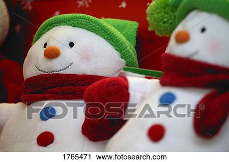 Stock Image - Close-Up of two Christmas decorations ( Snowmen ). Fotosearch