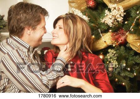 Couple at Christmas View Large Photo Image Stock Photograph - Couple at Christmas. Fotosearch