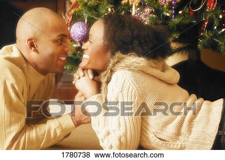 Stock Photo - Couple together on Christmas. Fotosearch