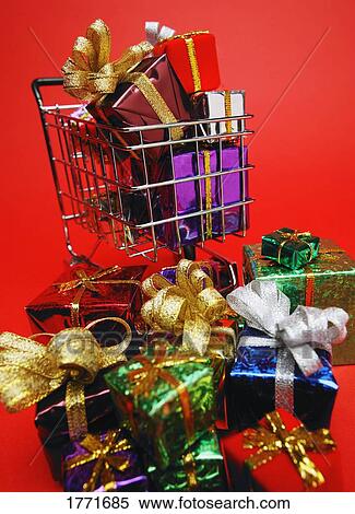Pile of presents near shopping cart View Large Photo Image Stock Photography - Pile of presents near shopping cart. Fotosearch