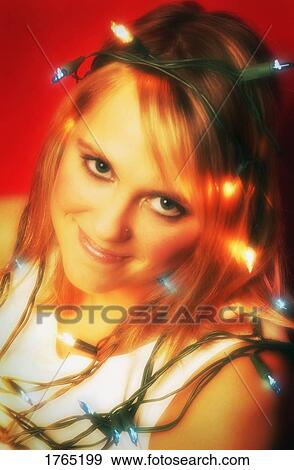Wrapped up in Christmas lights View Large Photo Image Stock Photo - Wrapped up in Christmas lights. Fotosearch