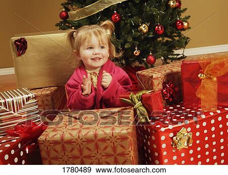 Stock Photo - A child excited about Christmas. Fotosearch