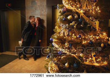 Stock Image - A Christmas kiss. Fotosearch