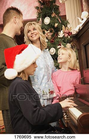 Stock Photography - A family at Christmas. Fotosearch
