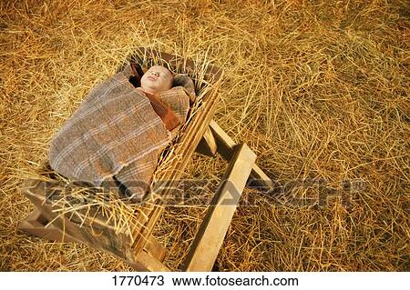 Baby Jesus Lying In A Manger Stock Image 1770473 Fotosearch