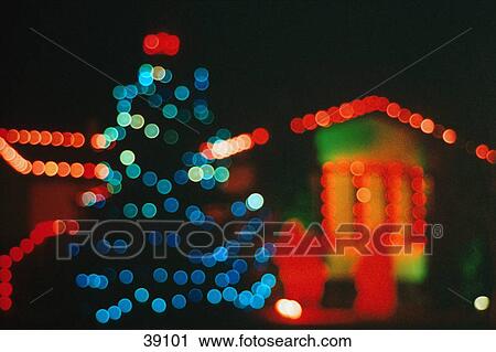 Stock Image - Blurred lights on tree and house. Fotosearch