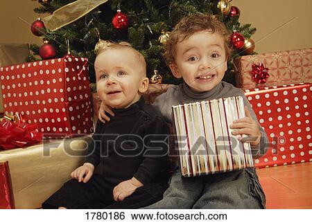 Children under Christmas tree View Large Photo Image Stock Photograph - Children under Christmas tree. Fotosearch
