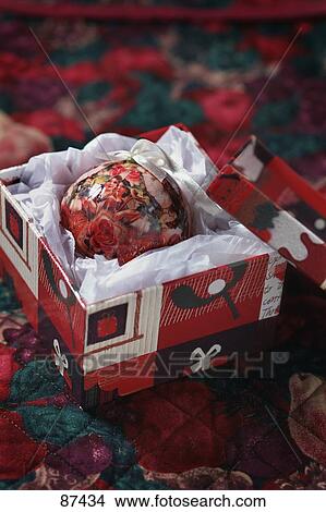 Picture - Decorative Christmas ball in gift box. Fotosearch