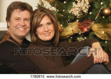 Stock Photography - Portrait of a couple at Christmas. Fotosearch