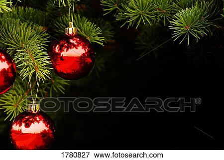 Stock Photo - Red Christmas ornament on tree. Fotosearch