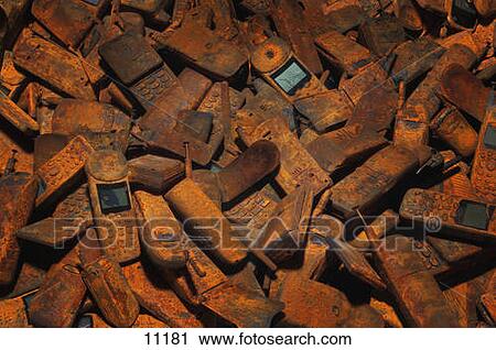 Stock Image - Discarded cell phones. Fotosearch