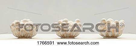 Eggs in three baskets View Large Photo Image Stock Image - Eggs in three baskets. Fotosearch