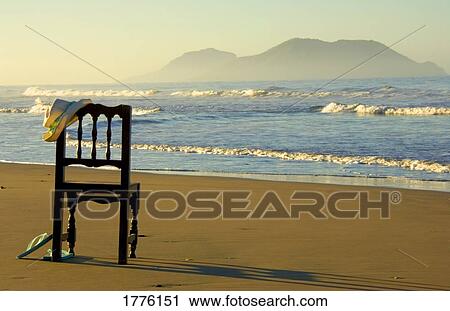 Empty chair on a beach View Large Photo Image Stock Image - Empty chair on a beach. Fotosearch