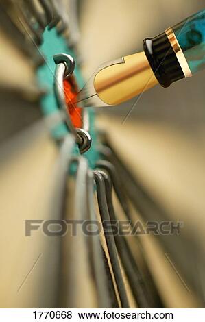 Stock Photo - Fountain pen in bulls-eye. Fotosearch