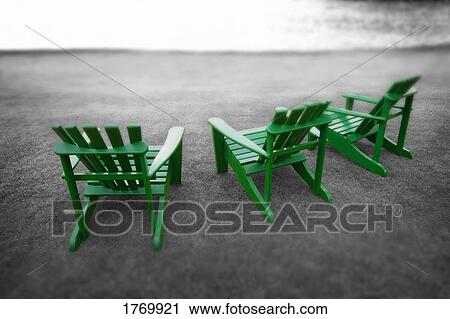 Stock Image - Lounge chairs on grass. Fotosearch