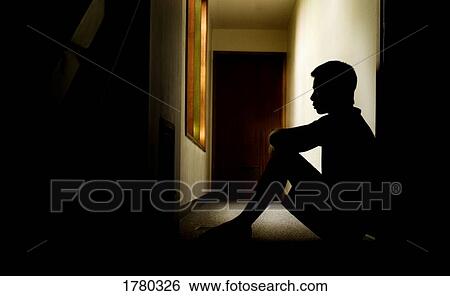 Stock Photograph - Sitting in a hallway. Fotosearch