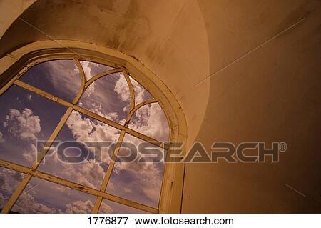 Stock Photo - Church window framing the sky. Fotosearch