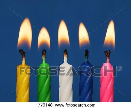Colourful candles lit View Large Photo Image Stock Photo - Colourful candles lit. Fotosearch