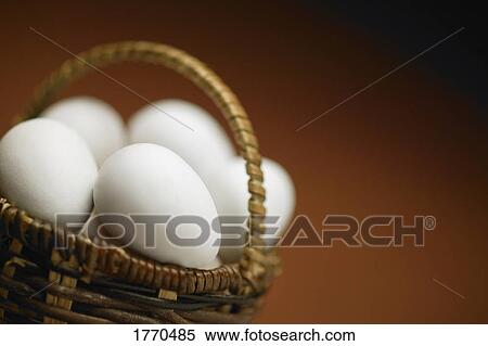 Stock Photography - Eggs in a basket. Fotosearch