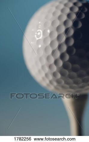 Golf ball on a golf tee View Large Photo Image Stock Photograph - Golf ball on a golf tee. Fotosearch