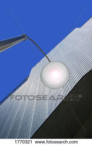 Stock Image - Industrial building and outside lamp. Fotosearch