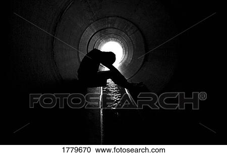 Stock Image - Person in culvert. Fotosearch