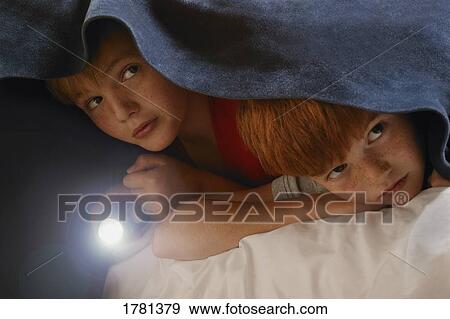 Children hide under blanket View Large Photo Image Stock Photo - Children hide under blanket. Fotosearch