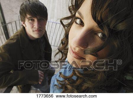 Close up of attractive trendy man and woman View Large Photo Image Stock Photograph - Close up of attractive trendy man and woman. Fotosearch