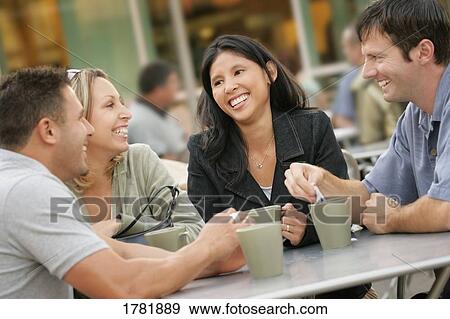 Stock Photo - Conversation at a cafe. Fotosearch