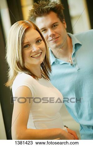 Couple hanging out together View Large Photo Image Stock Image - Couple hanging out together. Fotosearch