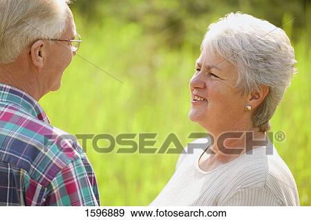 Stock Photo - Couple having a conversation. Fotosearch