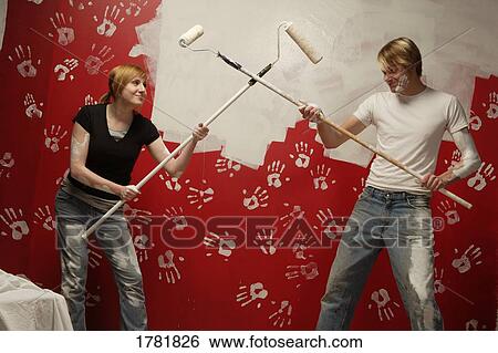 Stock Photograph - Couple painting together. Fotosearch