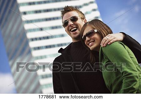 Stock Image - Couple with trendy sunglasses. Fotosearch