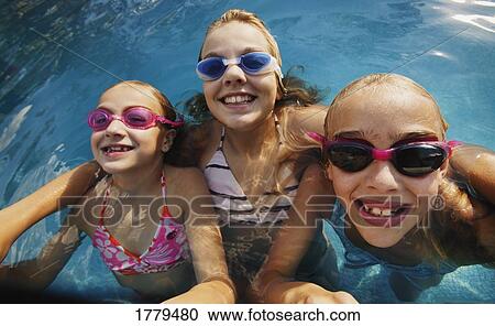 Stock Image - Girls with goggles. Fotosearch