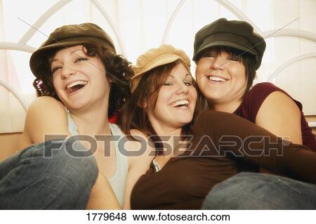 Stock Photo - Group of girls with hats. Fotosearch