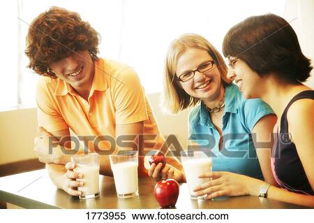 Group of teenagers eating View Large Photo Image Stock Photography - Group of teenagers eating. Fotosearch