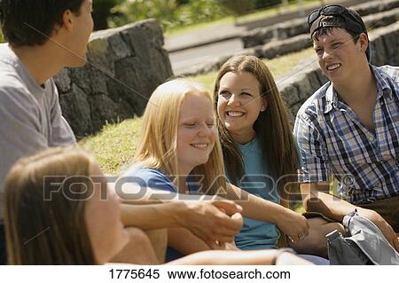 Group of teens talking View Large Photo Image Stock Photography - Group of teens talking. Fotosearch