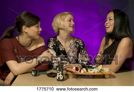 Three friends in a Japanese restaurant View Large Photo Image Stock Image - Three friends in a Japanese restaurant. Fotosearch