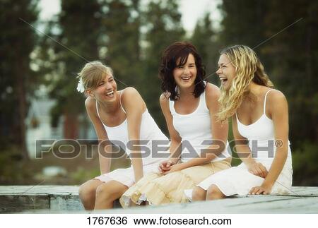 Three woman enjoy a laugh View Large Photo Image Stock Photograph - Three woman enjoy a laugh. Fotosearch