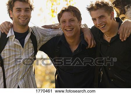 Stock Image - Three young male friends. Fotosearch